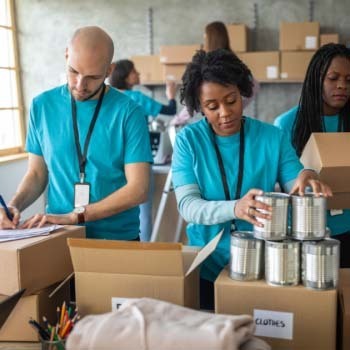 Volunteer workers taking inventory