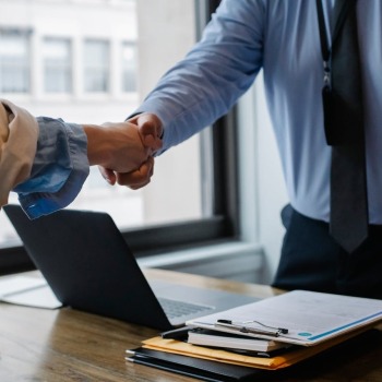 Two executives shaking hands