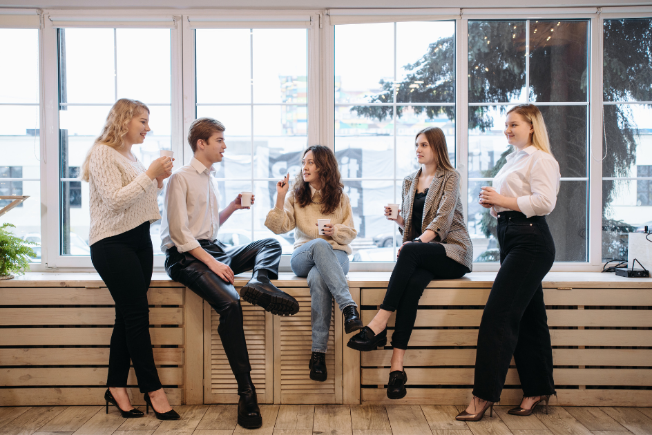 young professionals having a group conversation over coffee